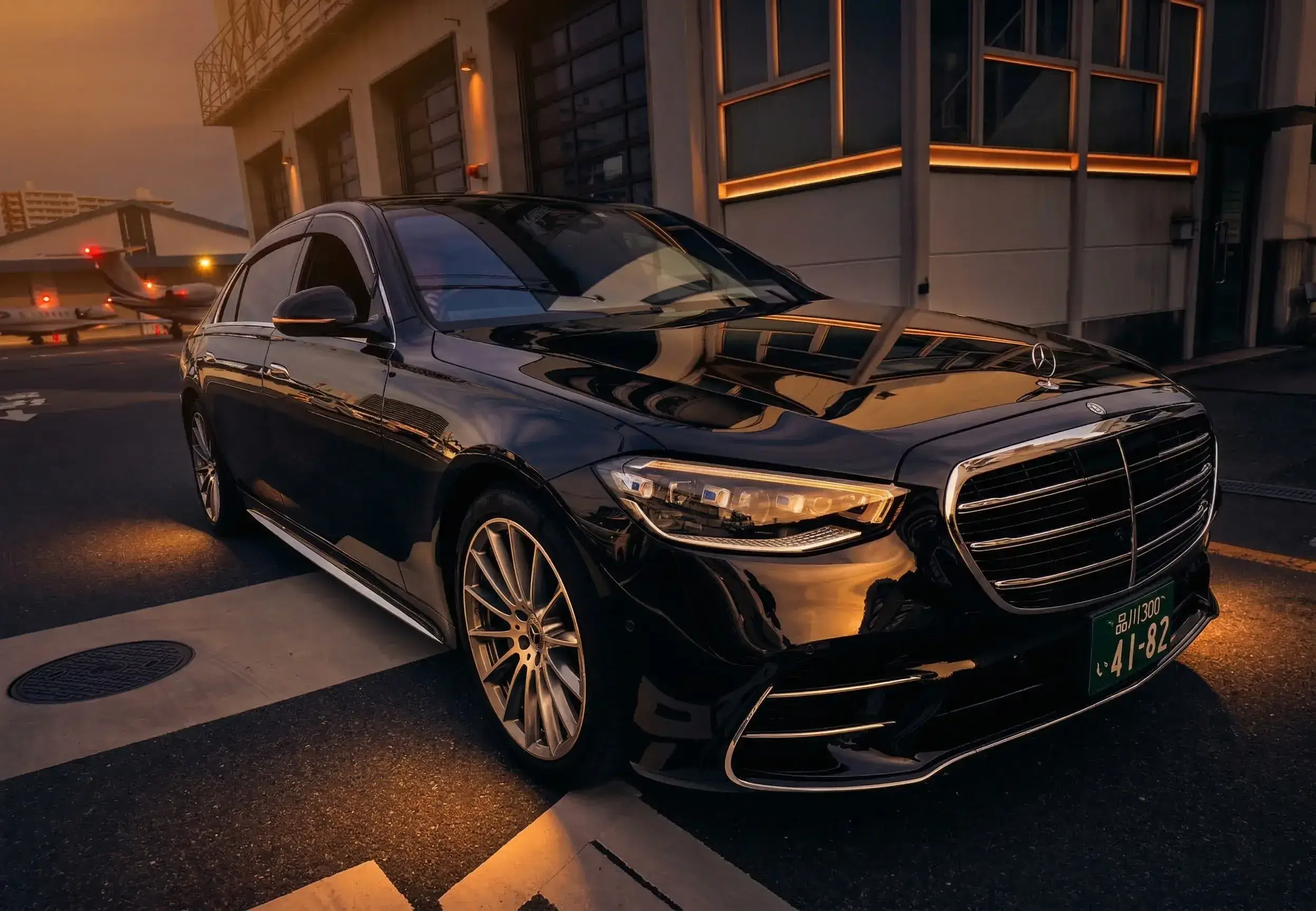 DRIVER Japan Mercedes-Benz S-Class at night near a private jet